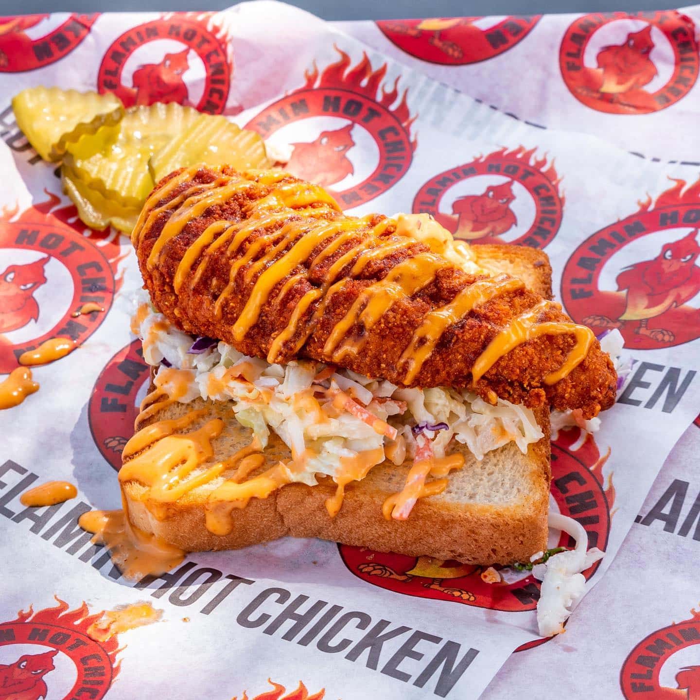 spicy chicken tender on texas toast with coleslaw